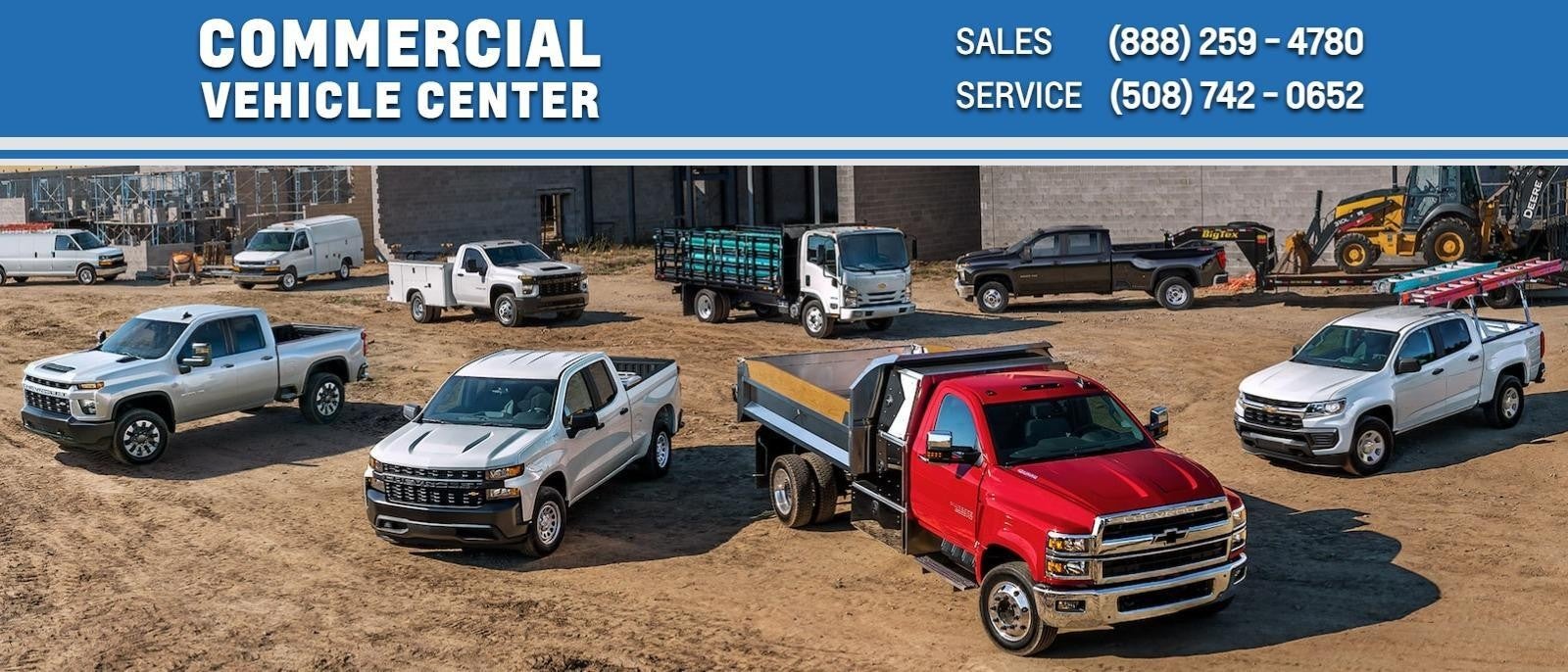 Six heavy duty commerical vehicles parked on a contruction site
